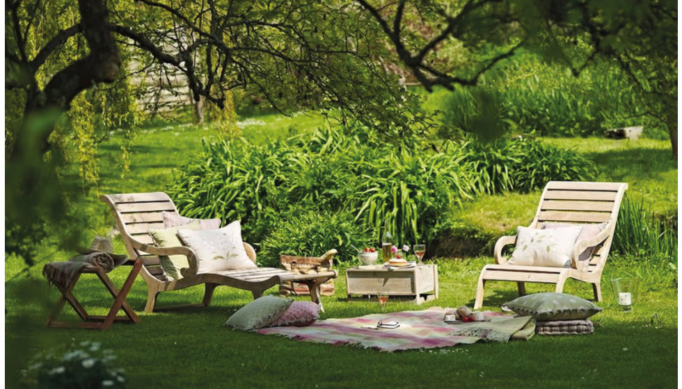 A picnic laid out in a garden.