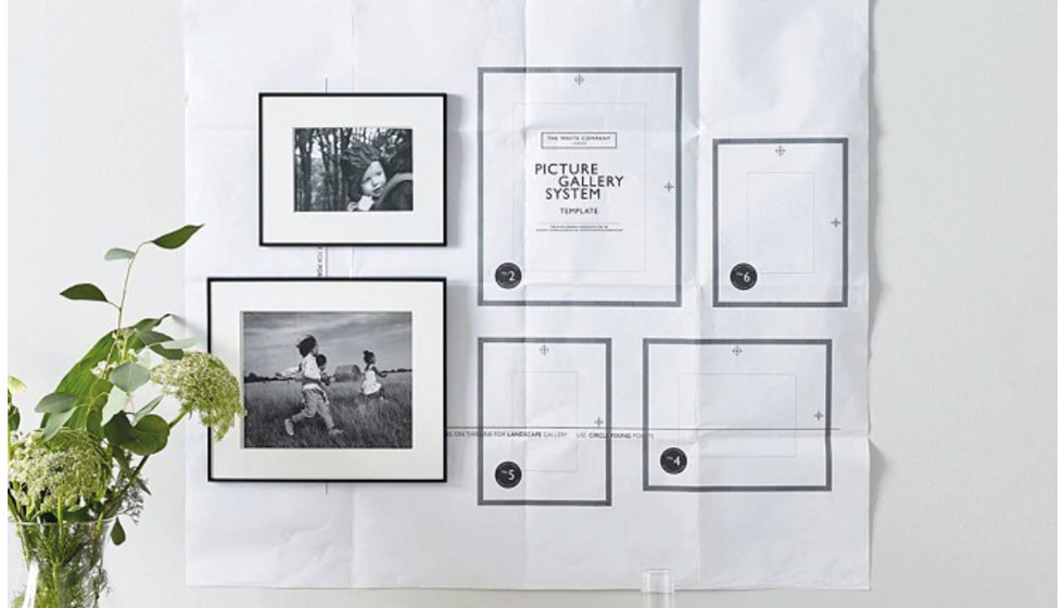 A sheet of paper shows you where to hang each photo in a pre made gallery wall.