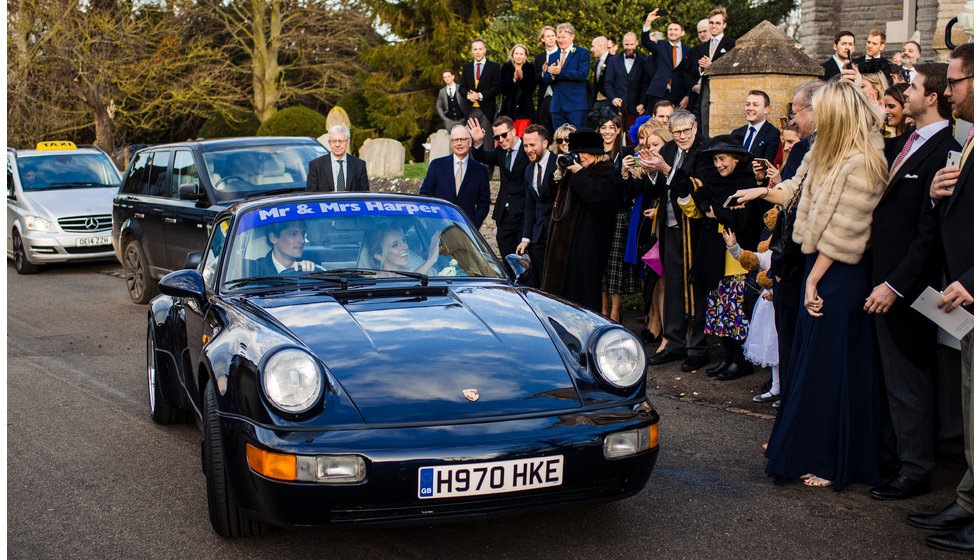 The porsche with Mr and Mrs Harper inside.