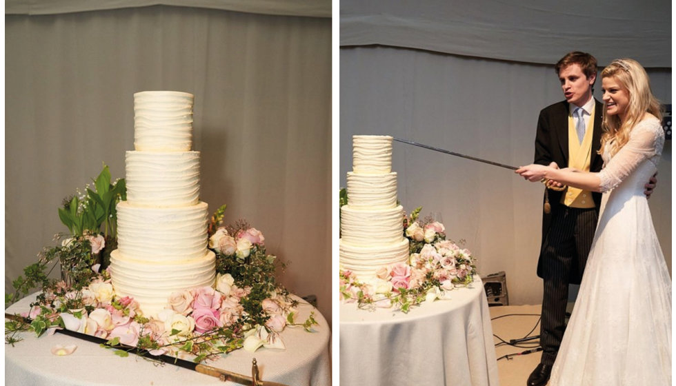 A four tiered red velvet wedding cake that the couple cut with a family sword.