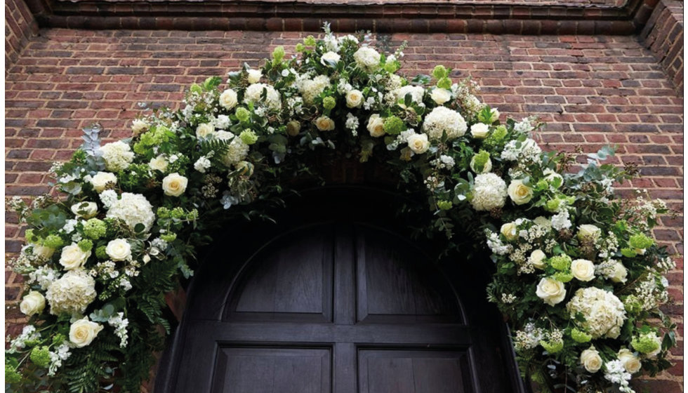 The flower arch outside the Church where the couple got married.