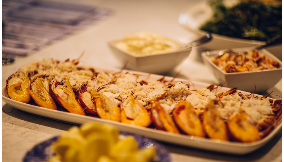 The lobster main dish laid on the table for guests to help themselves.