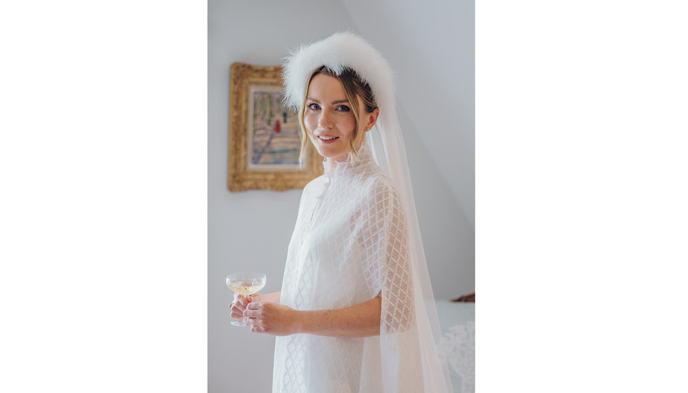 The bride had her hair up in her veil with lightly curled hair.