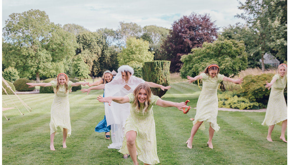 The bridesmaids and the bride danced on the lawn making Tik Tok videos.