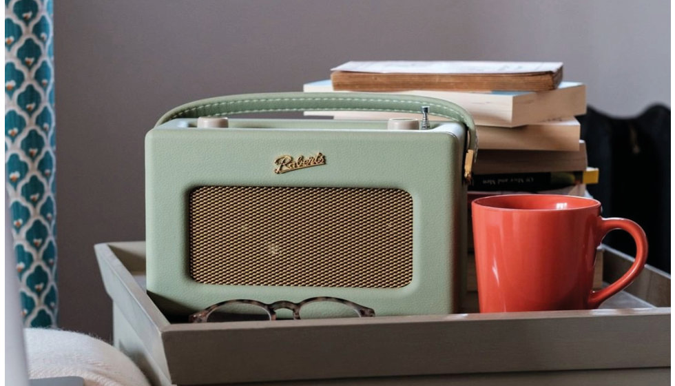 A roberts radio on a bedside table.