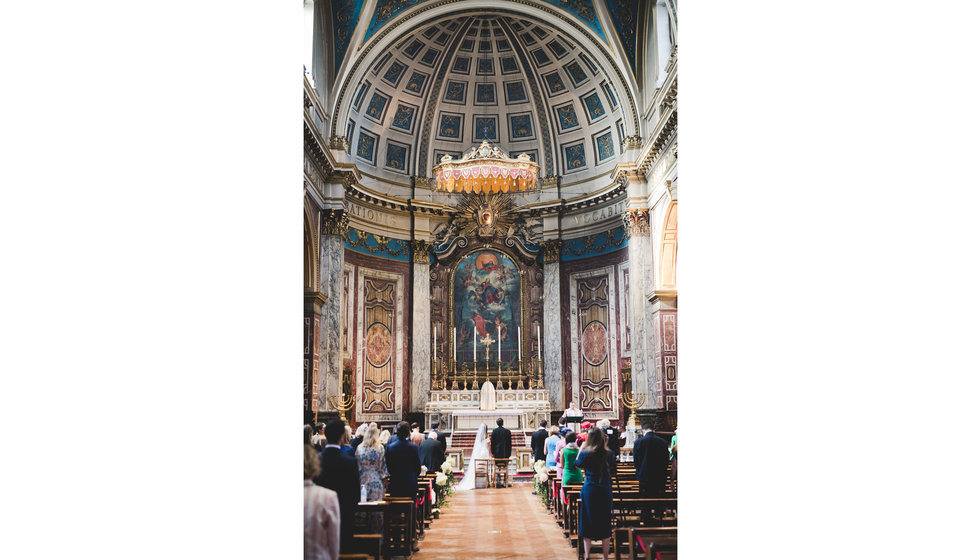 The bride and groom at the alter of the Brompton Oratory.