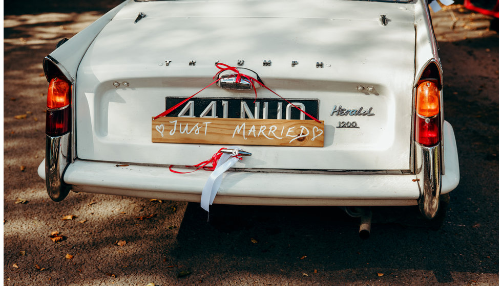 A close up of the couple's wedding car.