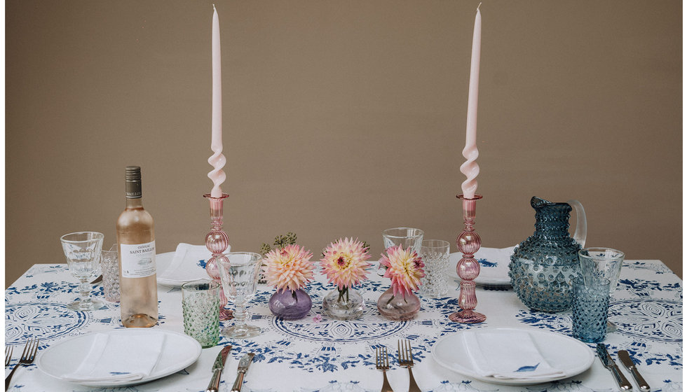 A colourful tablescape including Issy Granger's pink candlesticks. 