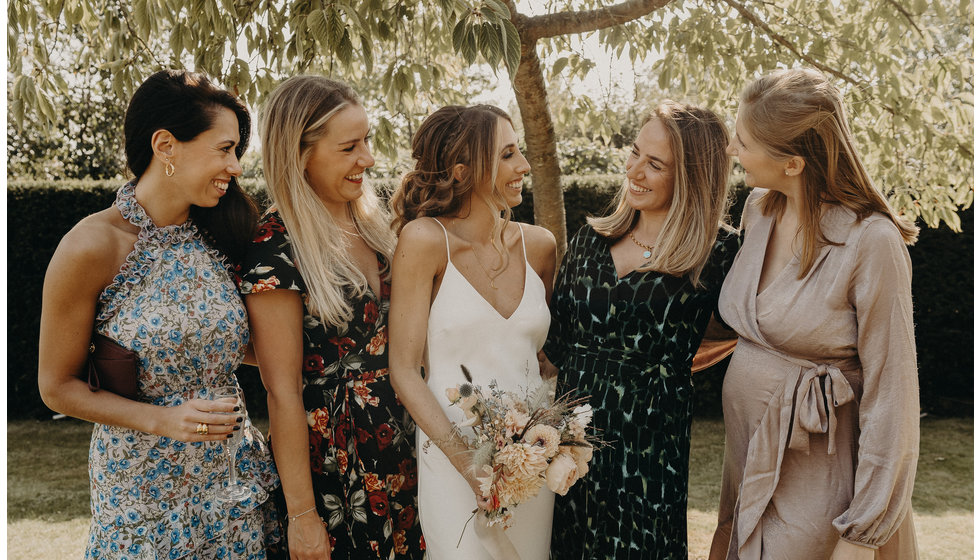The bride with her best friends on her wedding day. 