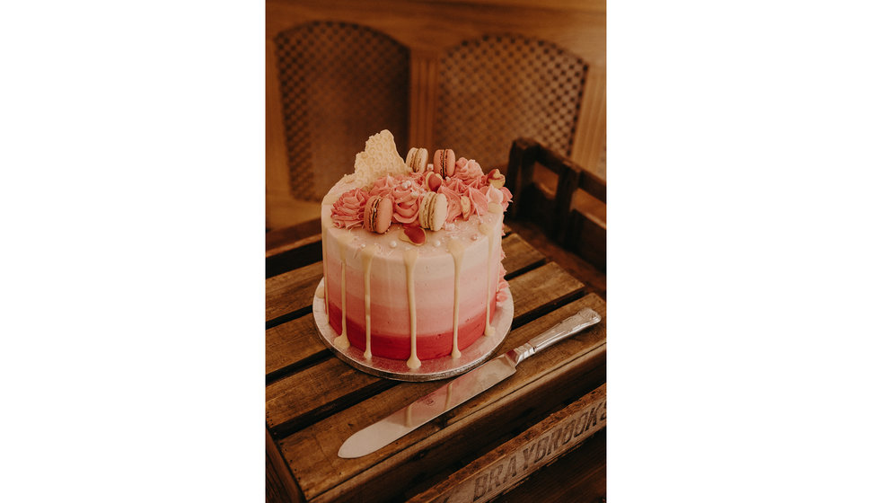 The bride and groom's pink wedding cake which they had for afternoon tea.