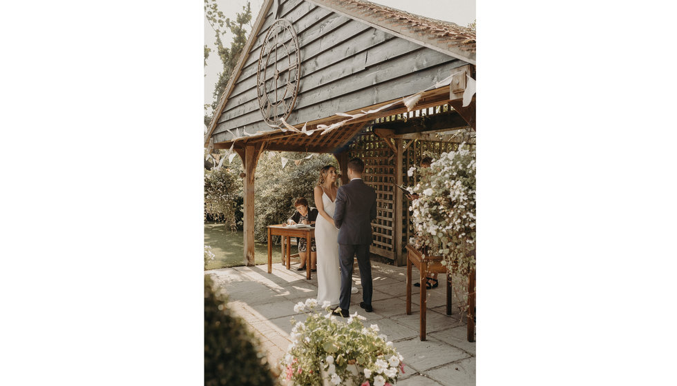The Wedding Venue was a beautiful barn where Louise and Matthew got married outside.
