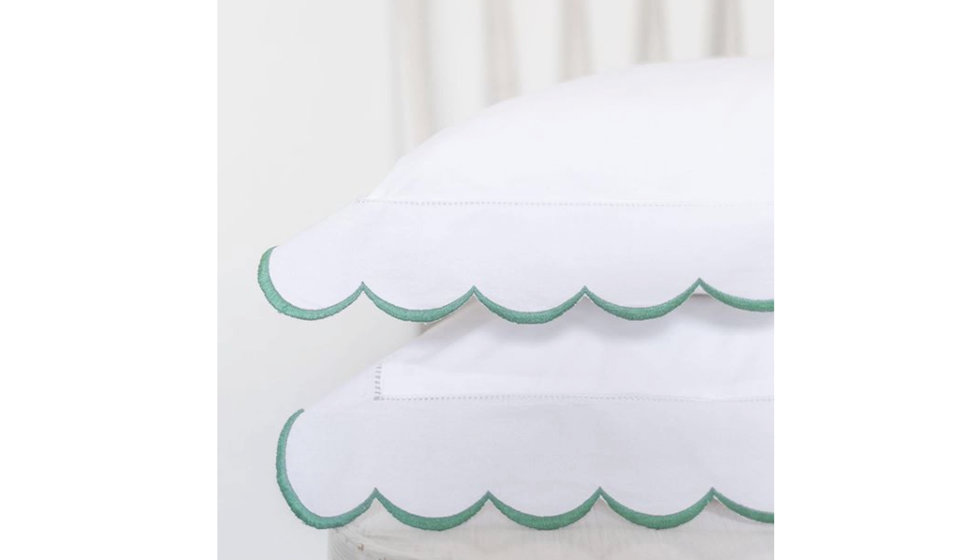 A green edged scalloped pillow case by SARAH K.