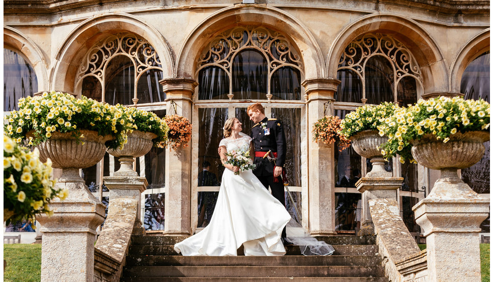 A photo of the bride and groom outside their Wiltshire Wedding Venue.