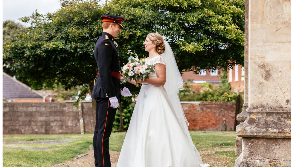 Charlotte and Matt outside the Church at their military wedding. 