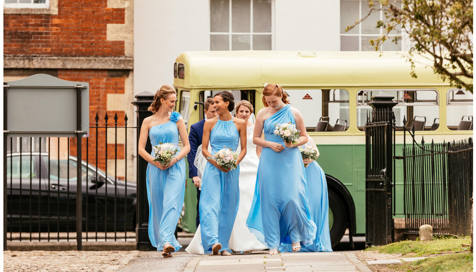 The bridesmaids all wore blue floor length dresses. 