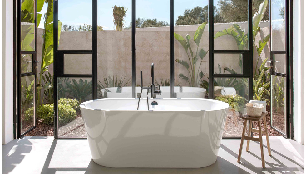 A large bath in front of the crittal windows of Finca Serena. 