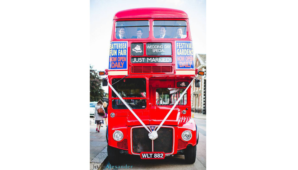 A old fashioned london bus to transport the wedding guests to the Savile Club from the Royal Hospital Chelsea.