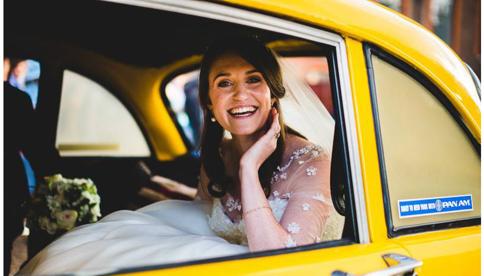The bride's natural wedding look - sitting in the back of a NYC yellow cab outside the Royal Hospital Chelsea.