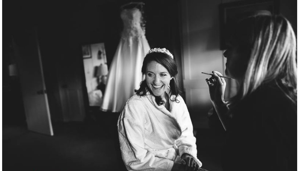 The bride having her make up done on the morning of her wedding by a London Based make up artist Anna gibson.