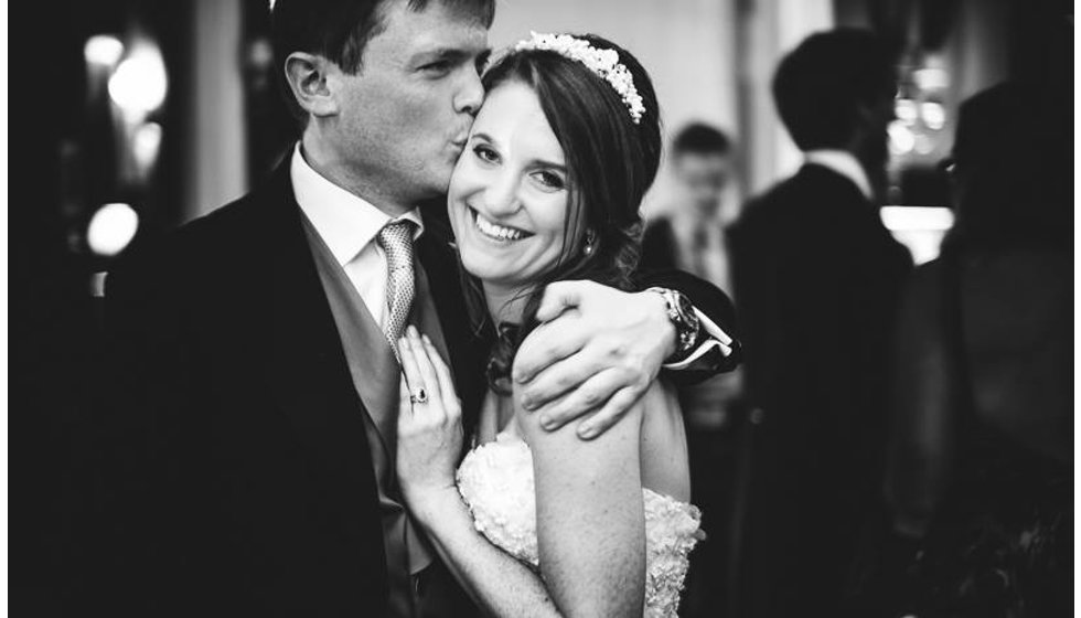 Will and Lexie sharing a hug at their wedding reception at the Savile Club in London. 