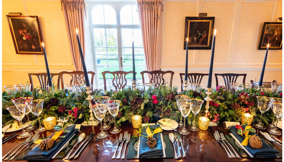 The wedding table of Edwina and Edward with festive but elegant flowers.