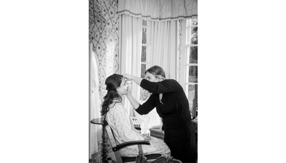 The bride having her makeup done.
