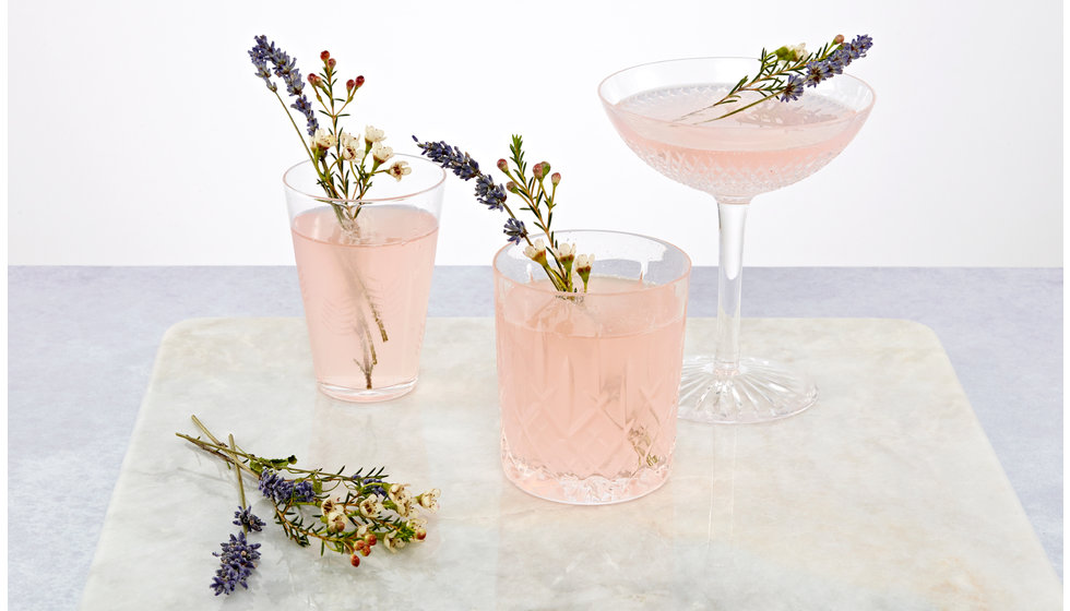 Three pink cocktails.