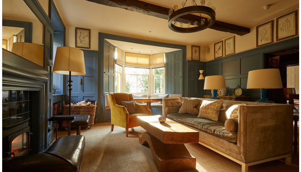 A sitting room in the Dormy House Hotel. A blue and yellow colour scheme.