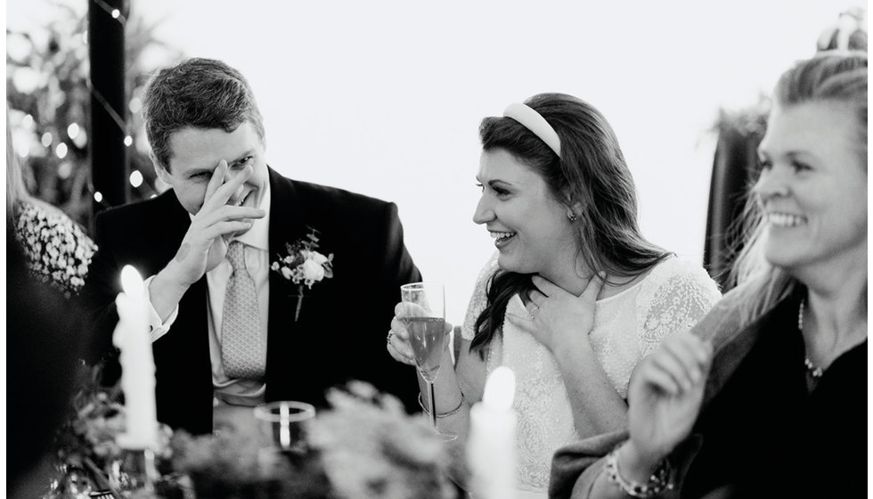 Sarah and Fergus laughing during the speeches.