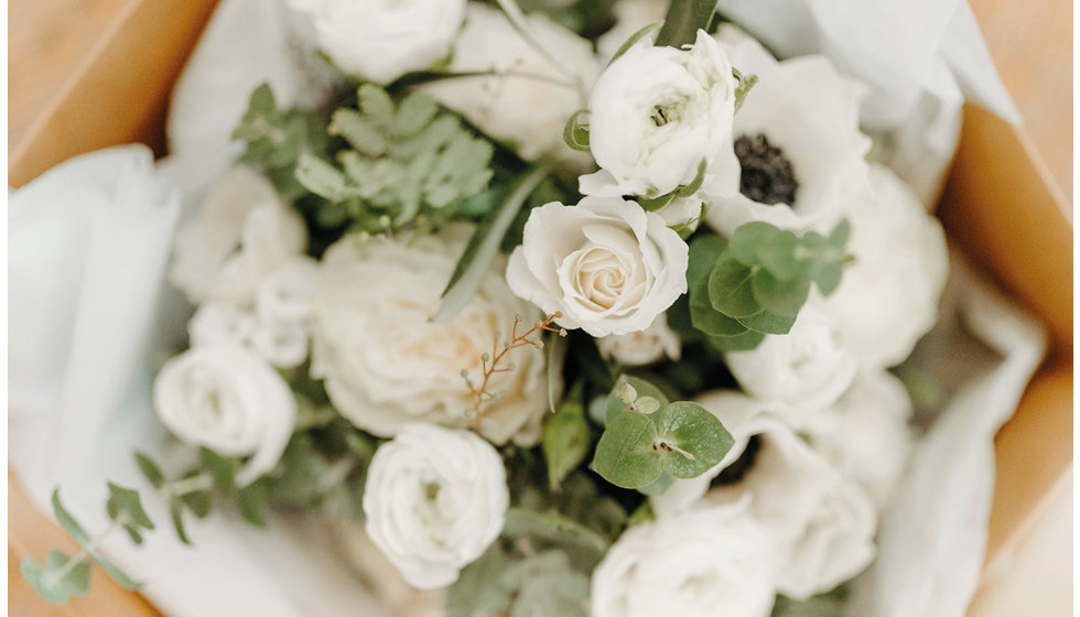 The bride's bouquet was made up of seasonal white flowers including anemones.