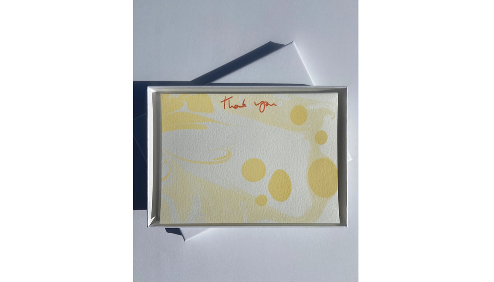 A pack of Heather Evelyn yellow marble thank you cards. 