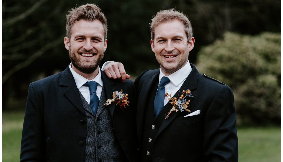 The groom and his best man outside dressed in traditional suit and kilt. 