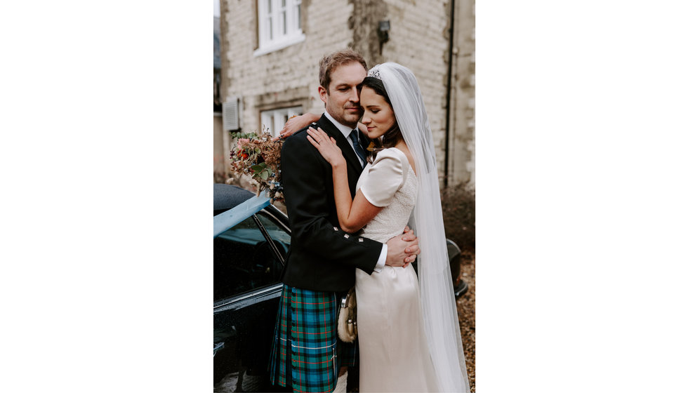 Sophie and Graeme embrace outside Langrish house.