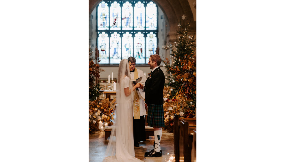 Sophie and Graeme at the alter during their intimate Hampshire wedding.