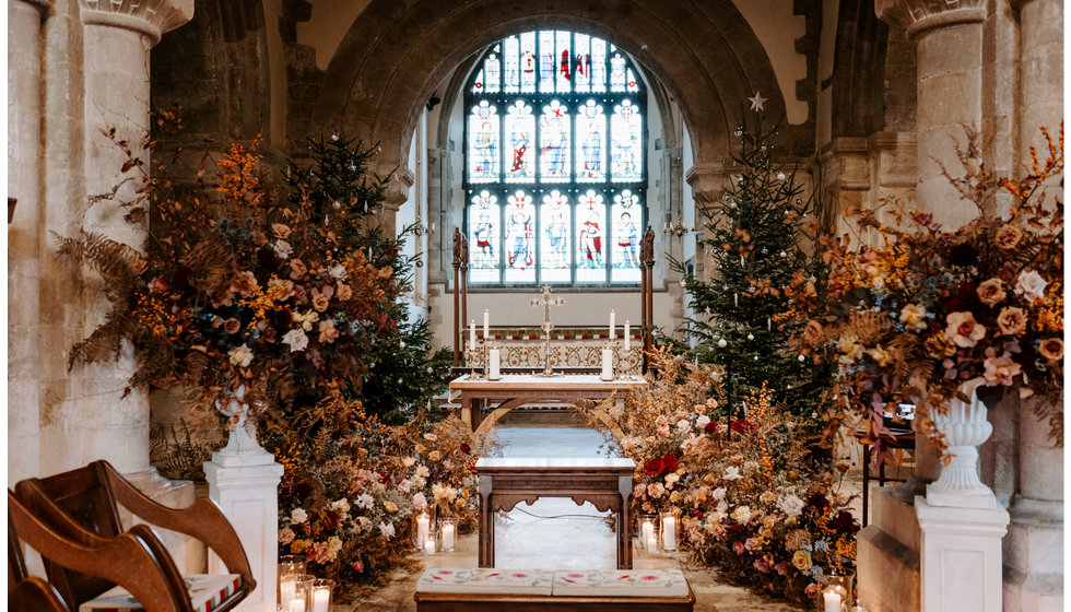 The interior of the East Meon Church where Sophie and Graeme got married. The church was adorned with wintery roses and foliage. 