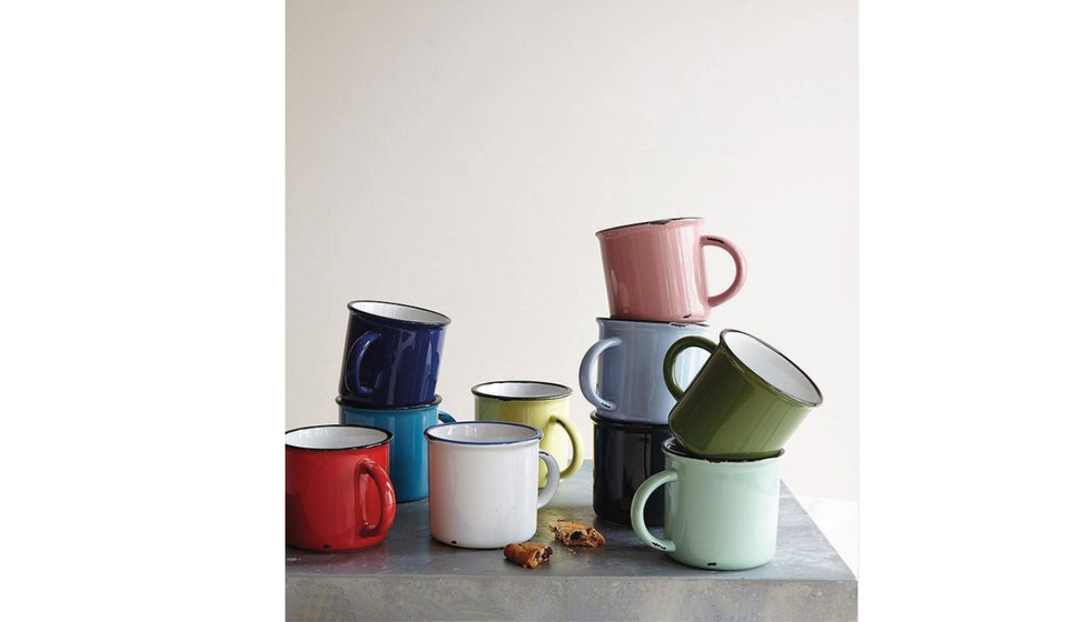 An array of colourful enamel colourful espresso cups. 