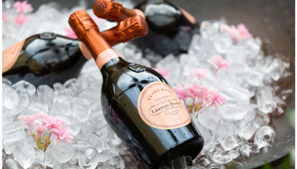 Laurent Perrier Champagne served on ice with flowers in the ice.