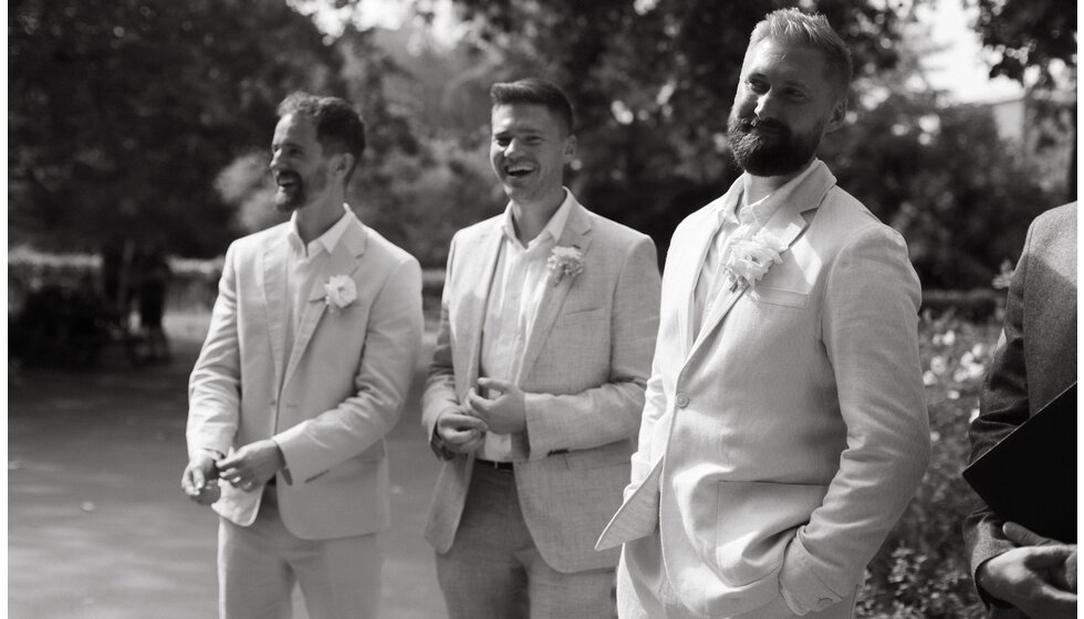 Whimsical Floral Wedding in London Park | The groom and groom's party in matching suits are waiting for a bride to come