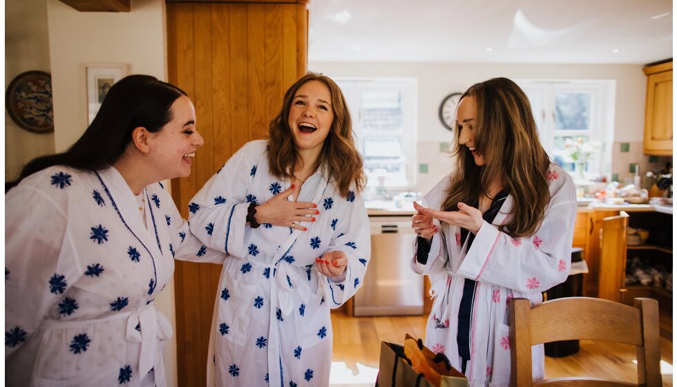 The Wedding Present Company | A bride and bridesmaids in matching bathing robes