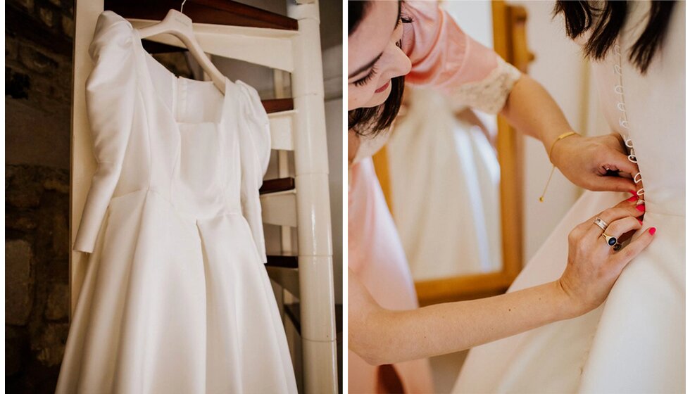 The Wedding Present Company | Bridal preparation moments capturing a hanging Jesus Peiro dress gown and bridesmaid helping the bride to button up her dress