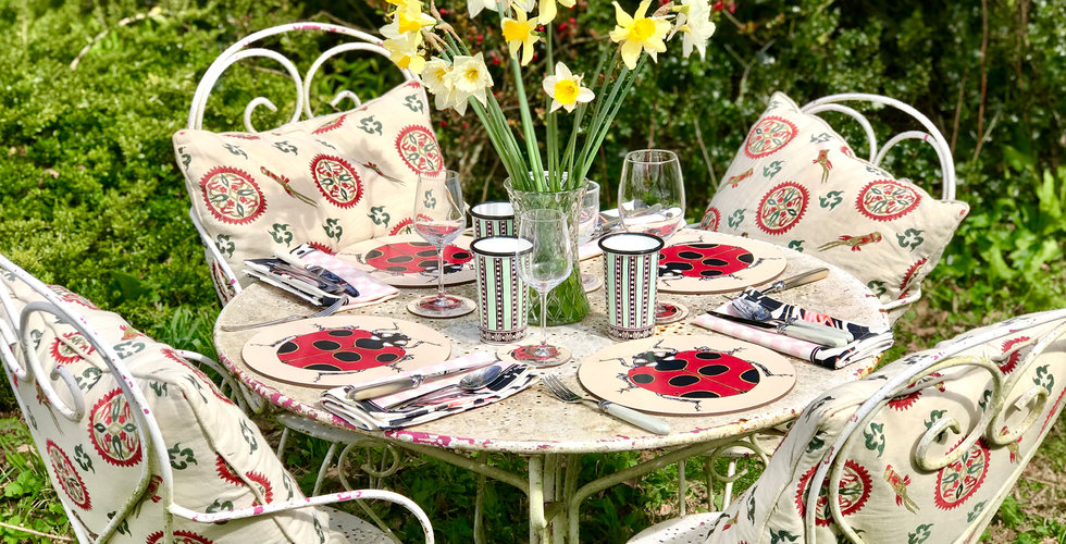 An outdoor tablescape using Bell's ladybird placemats.