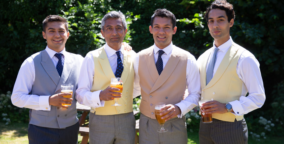 Groom Jamie, his father and his brothers on his wedding day - all wearing waste coats and ties. 
