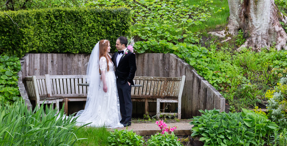 Sarah and Nico outside in the gardens of their East Sussex Wedding. 